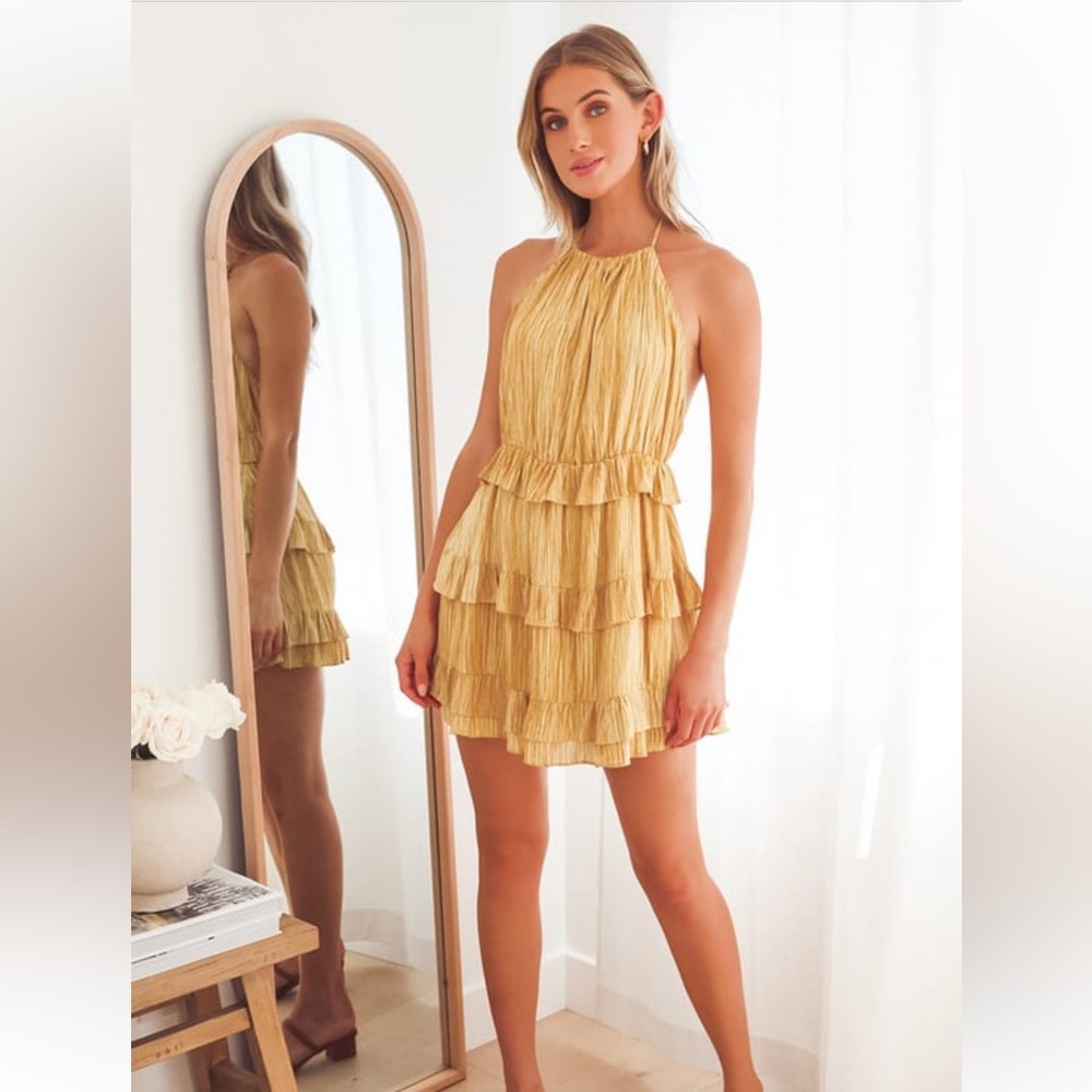 Beautiful halter, metallic dress. Never been worn - with tags!